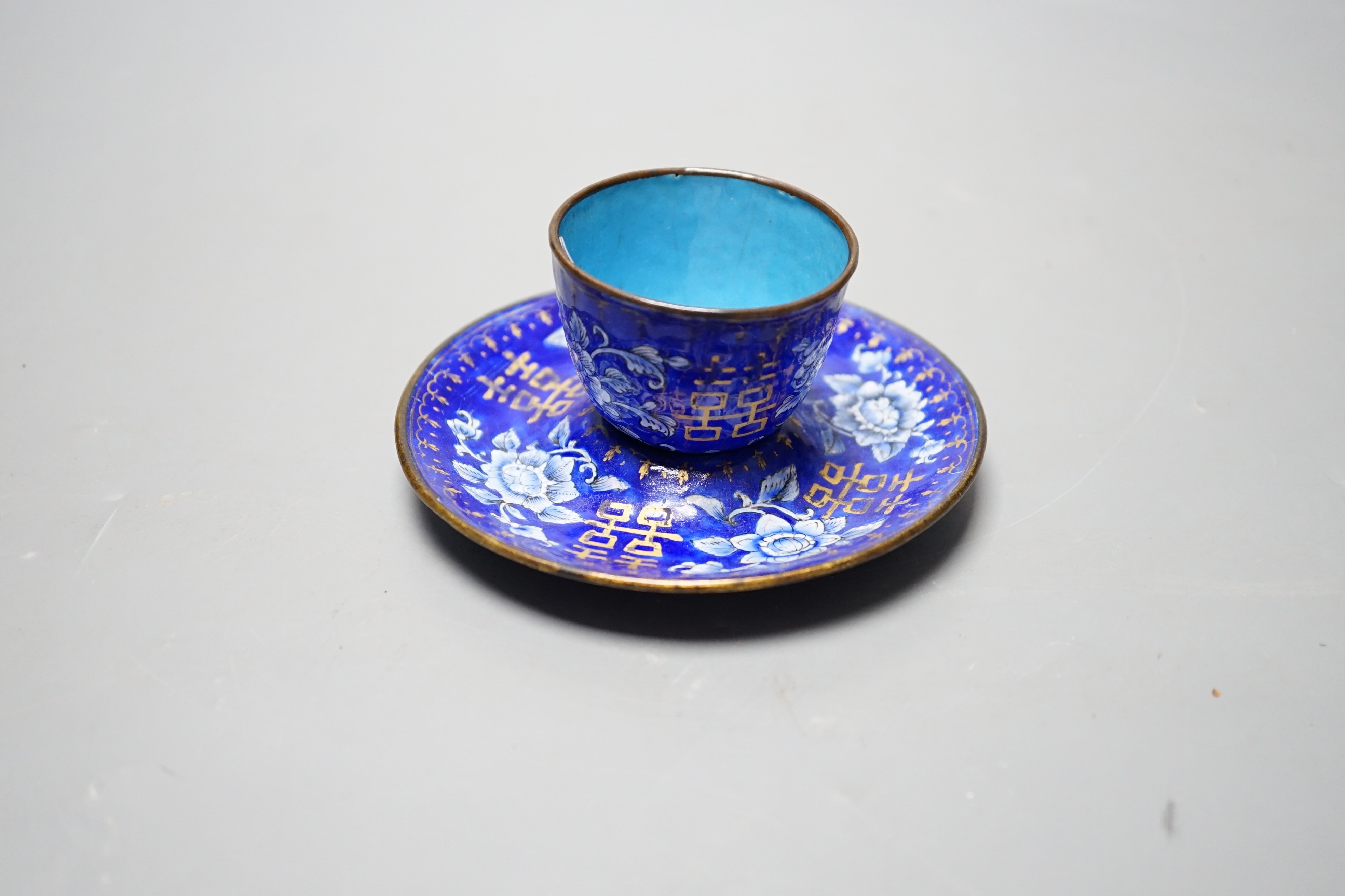 A 19th century Chinese Guangzhou enamel cup and saucer, 11cm diameter